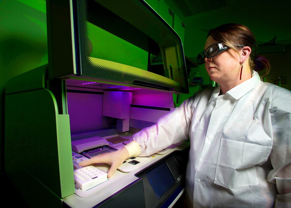 A scientist using a whole genome DNA sequencer, in order to determine the “DNA fingerprint” of a specific bacterium. Original image sourced from US Government department: Public Health Image Library, Centers for Disease Control and Prevention. Under US law this image is copyright free, please credit the government department whenever you can”.